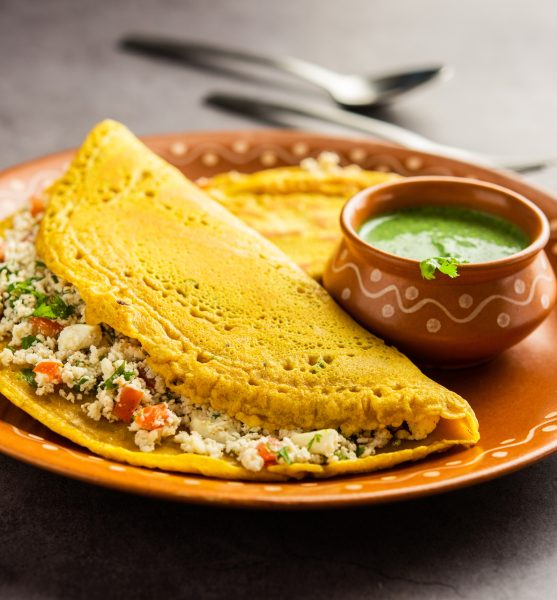 Paneer stuffed Besan chilla or Cheela made using chickpea flour with cottage cheese stuffing