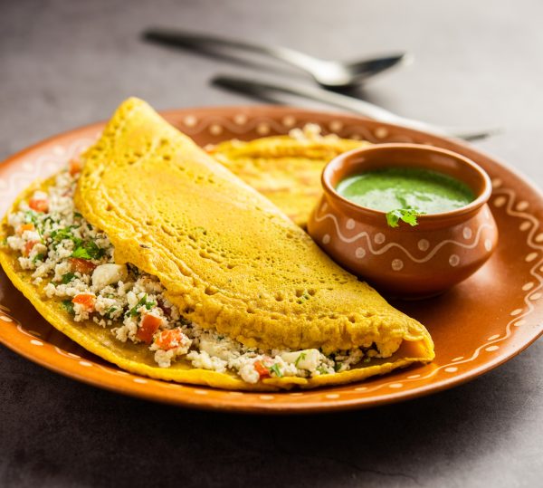 Paneer stuffed Besan chilla or Cheela made using chickpea flour with cottage cheese stuffing
